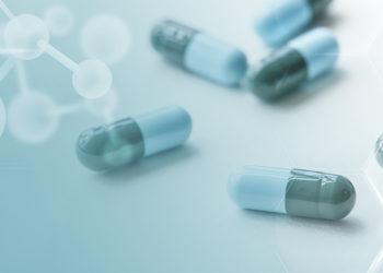 Medicine capsules global health with geometric pattern digital remix