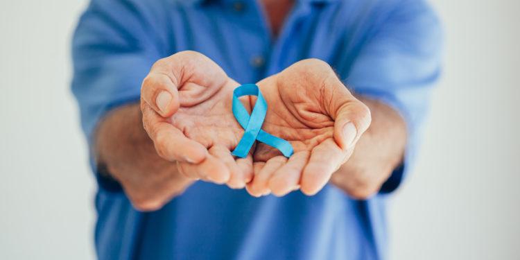 Prostate Cancer Awareness. Man with light Blue Ribbon for supporting people living and illness. Men Healthcare and World cancer day concept